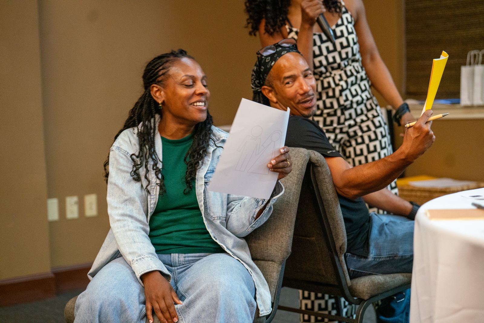 Couples laughing during a session activity